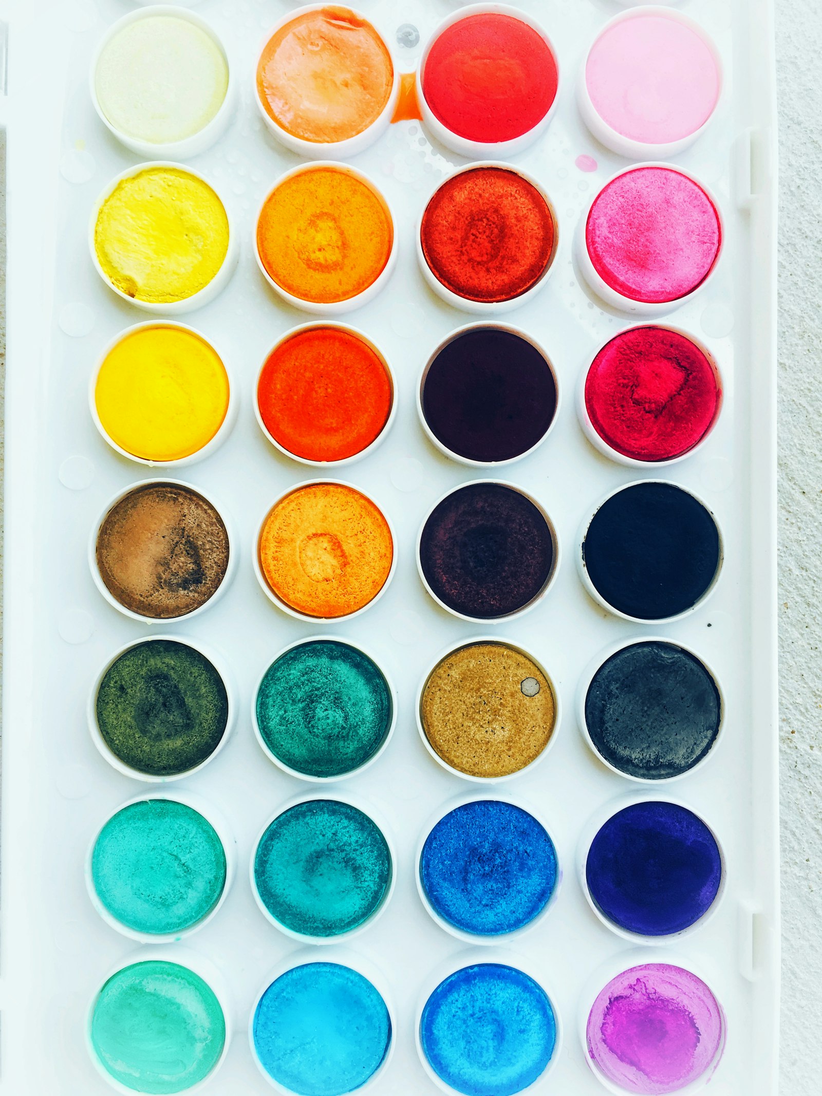 Paint swatches fanned out in a rainbow